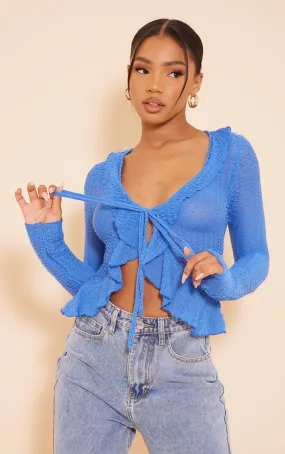 Chemise en maille texturée bleue effet volanté à nouer devant